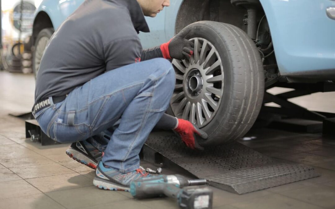 Mechanic Installing New Car Tire