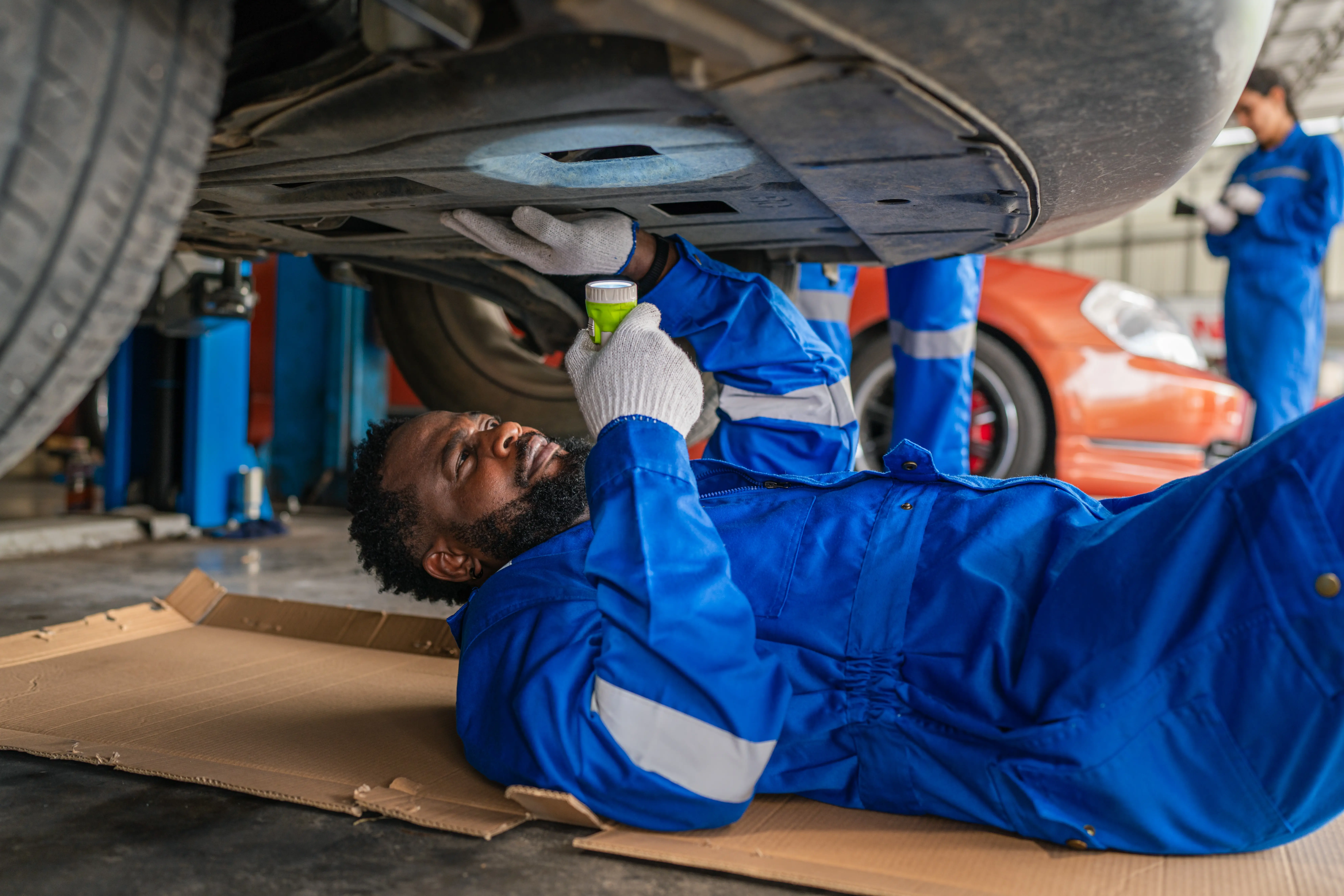 Male Mechanic Doing Automotive Repairs Service