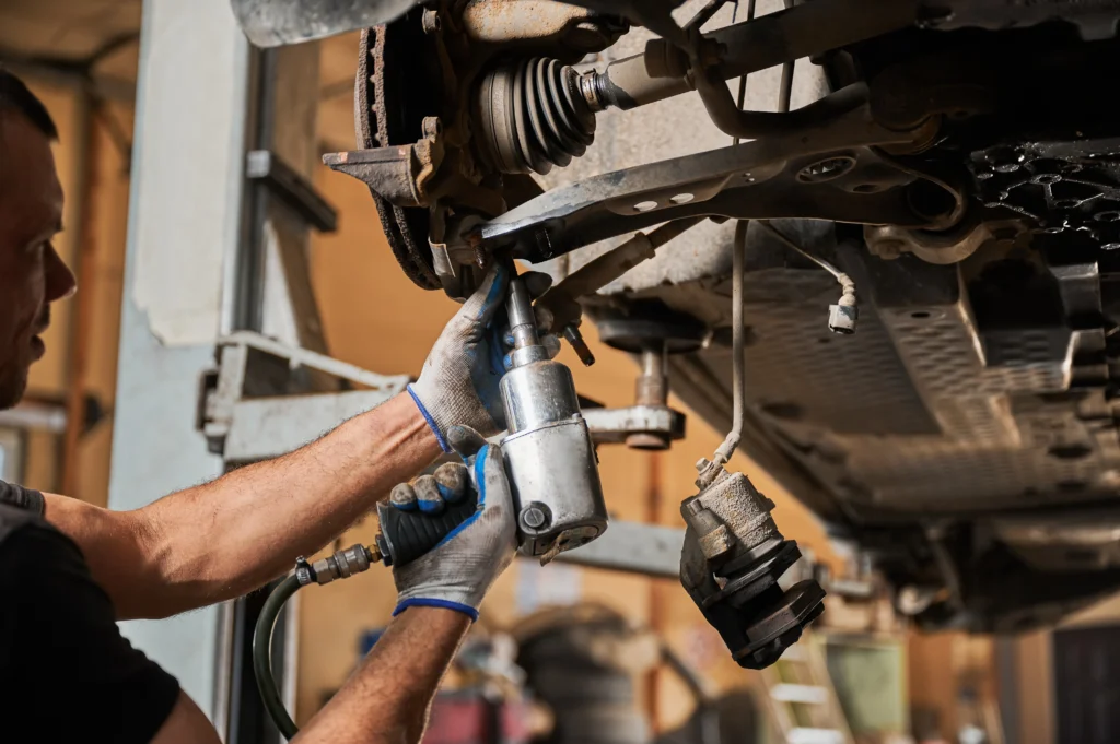 Mechanic Doing Car Suspension Repair 